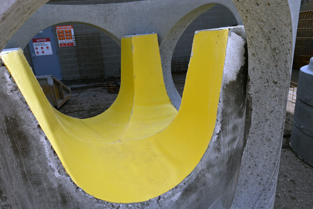 image of an HDPE-lined pre-benched maintenance hole.