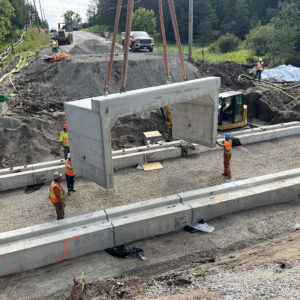 Tri-span unit suspended by a crane
